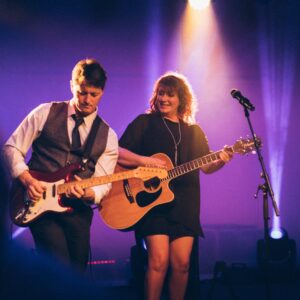 The band "Double Talk" performing on a stage.